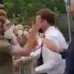 Watch: Macron Slapped in Face During Tour of France